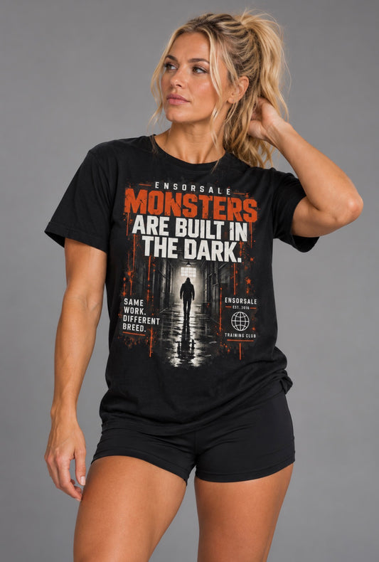 MONSTERS ARE BUILT IN THE DARK T-Shirt