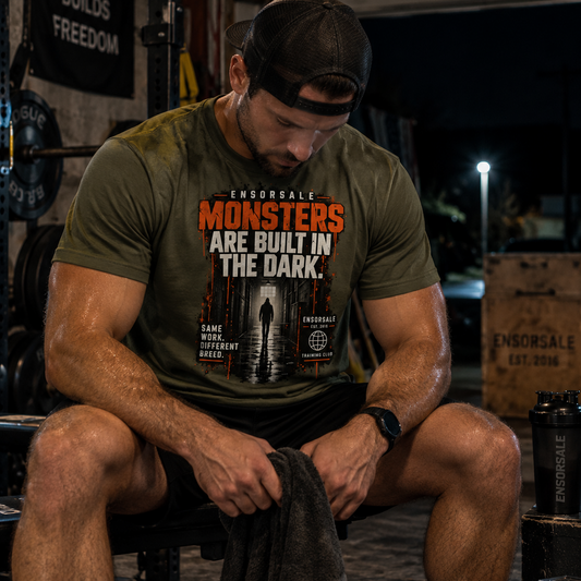 MONSTERS ARE BUILT IN THE DARK T-Shirt